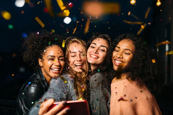People laughing using virtual photo booth