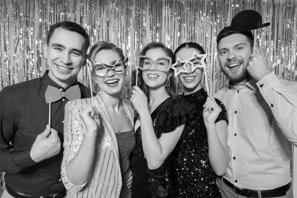 Workmates posing in a glam photo booth