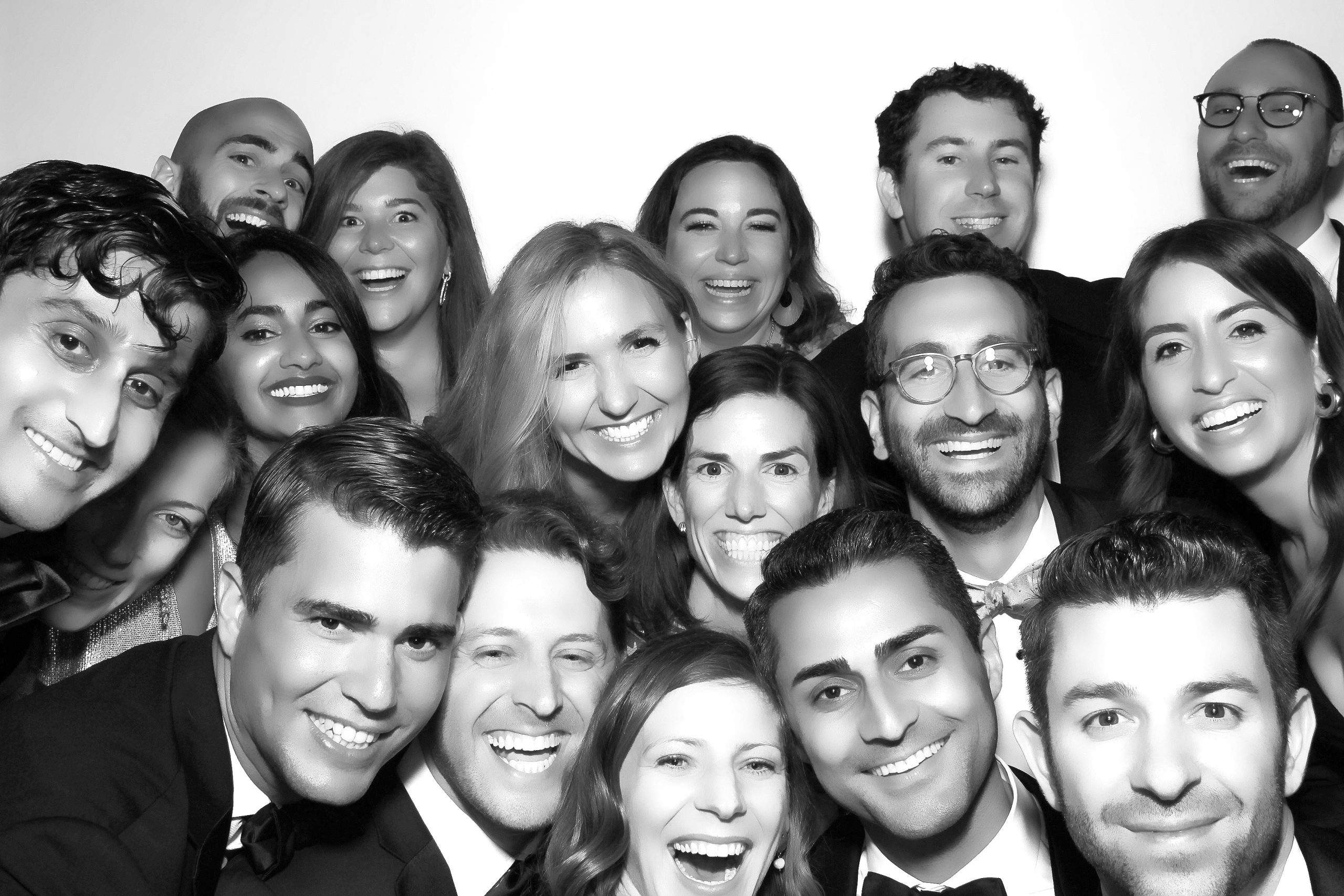 Guests posing in the Glam photo booth with studio lighting