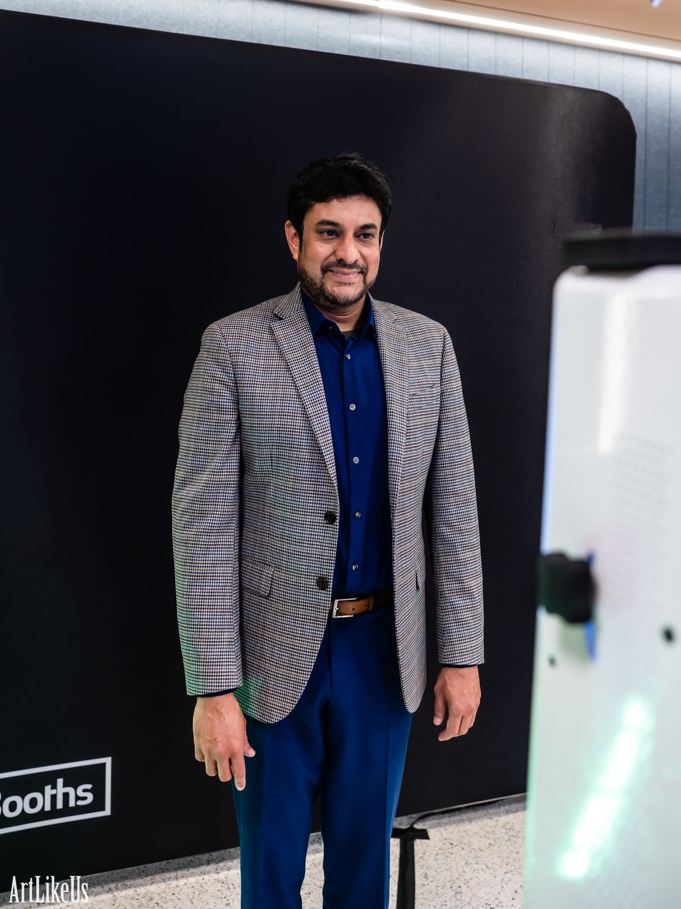 A guest standing at the DigiBooths light painting backdrop before the LED wand comes out