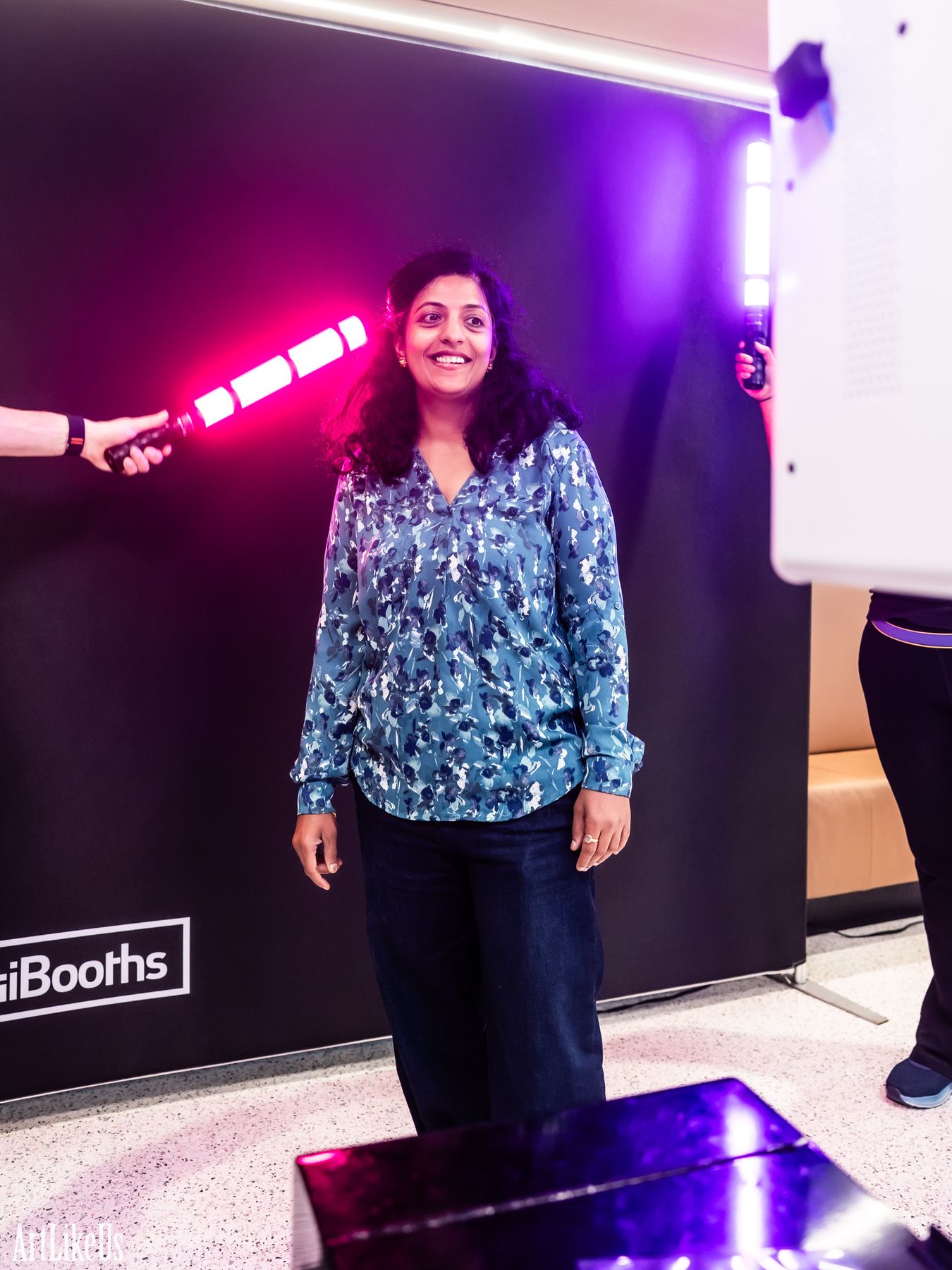 A guest standing at the DigiBooths light painting backdrop before the LED wand comes out
