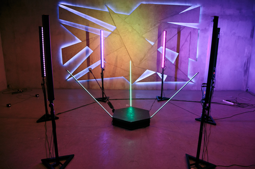 The orbit 360 booth's hexagonal platform and sweeping camera arm, set up and lit for an event