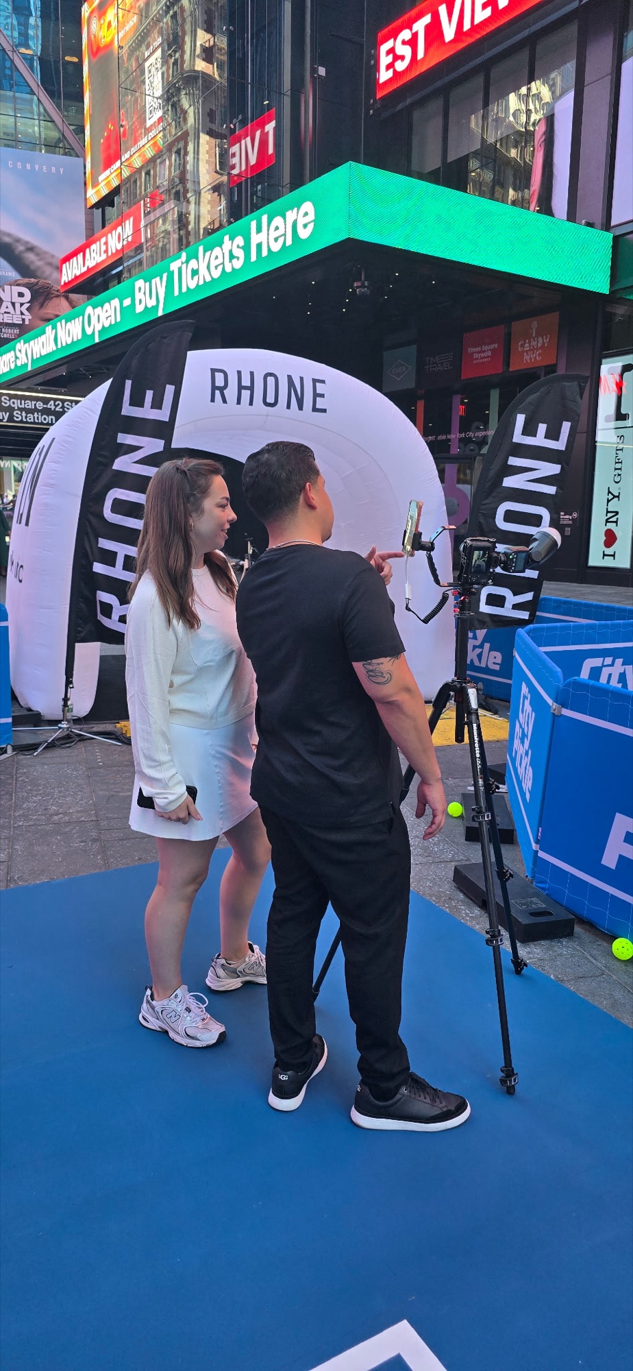Behind the scenes — our roaming photographer framing a shot at the Rhone activation in Times Square