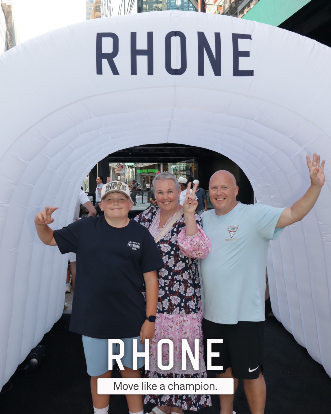 Guests posing together in the branded Rhone tunnel, Times Square NYC
