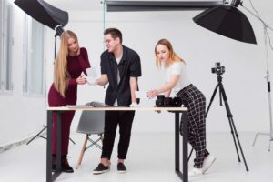 People viewing printed photo booth images
