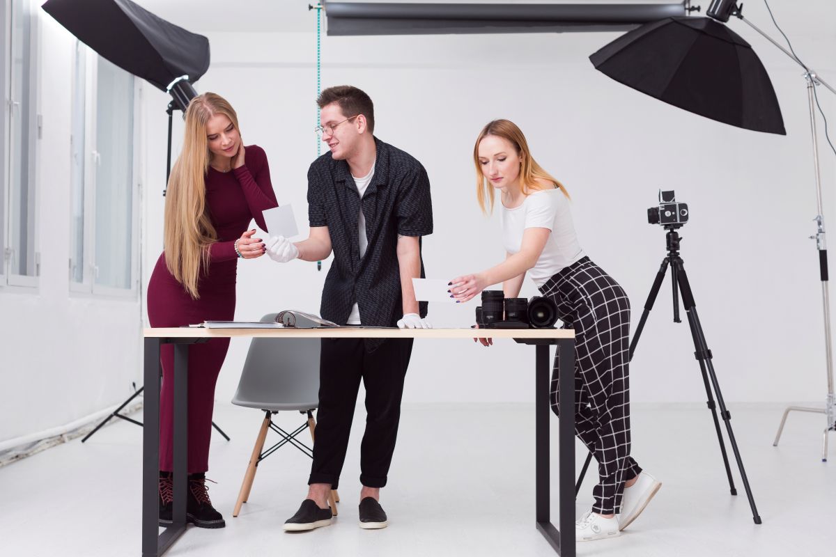 People viewing printed photo booth images