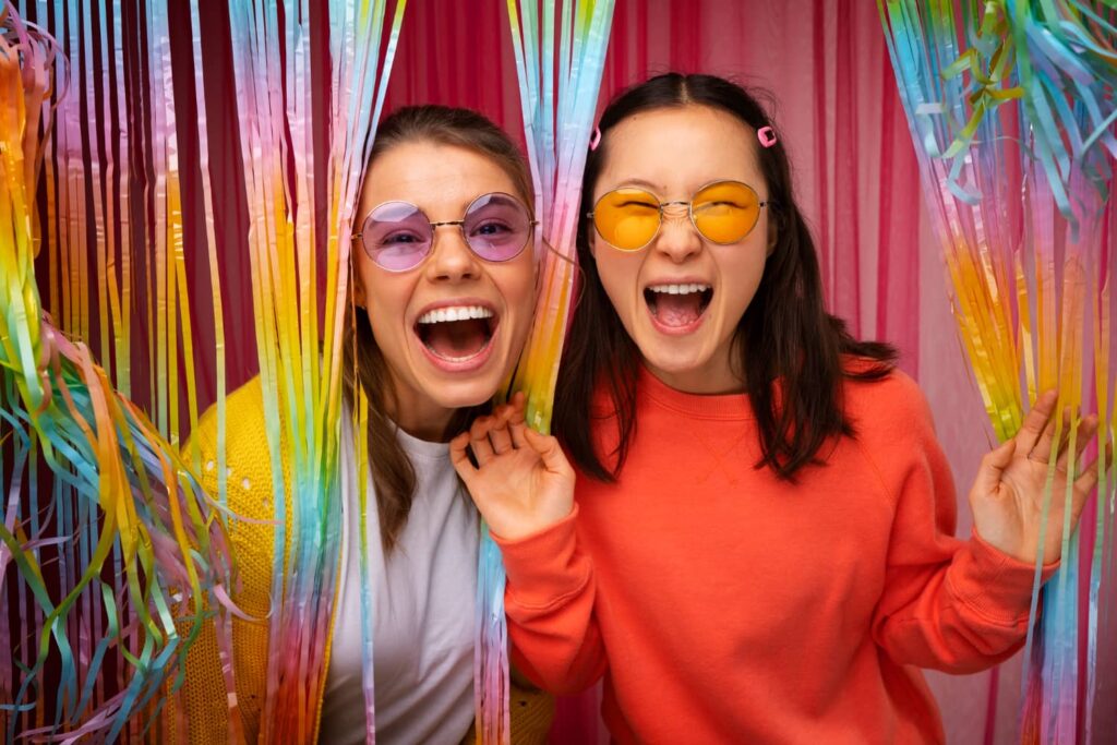 Friends posing in a photo booth rental