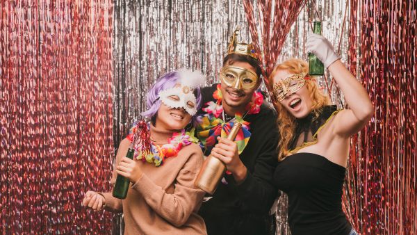 Group adding props to 360 photo booth