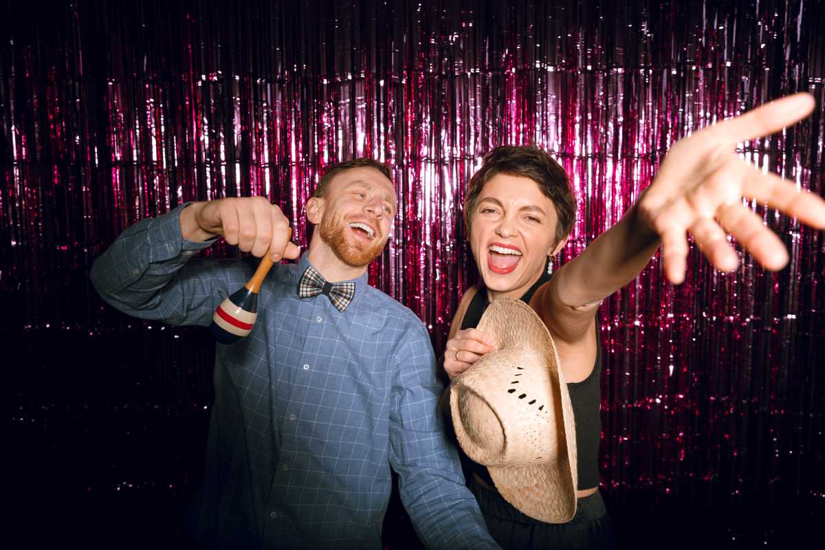 People posing inside a 360 photo booth